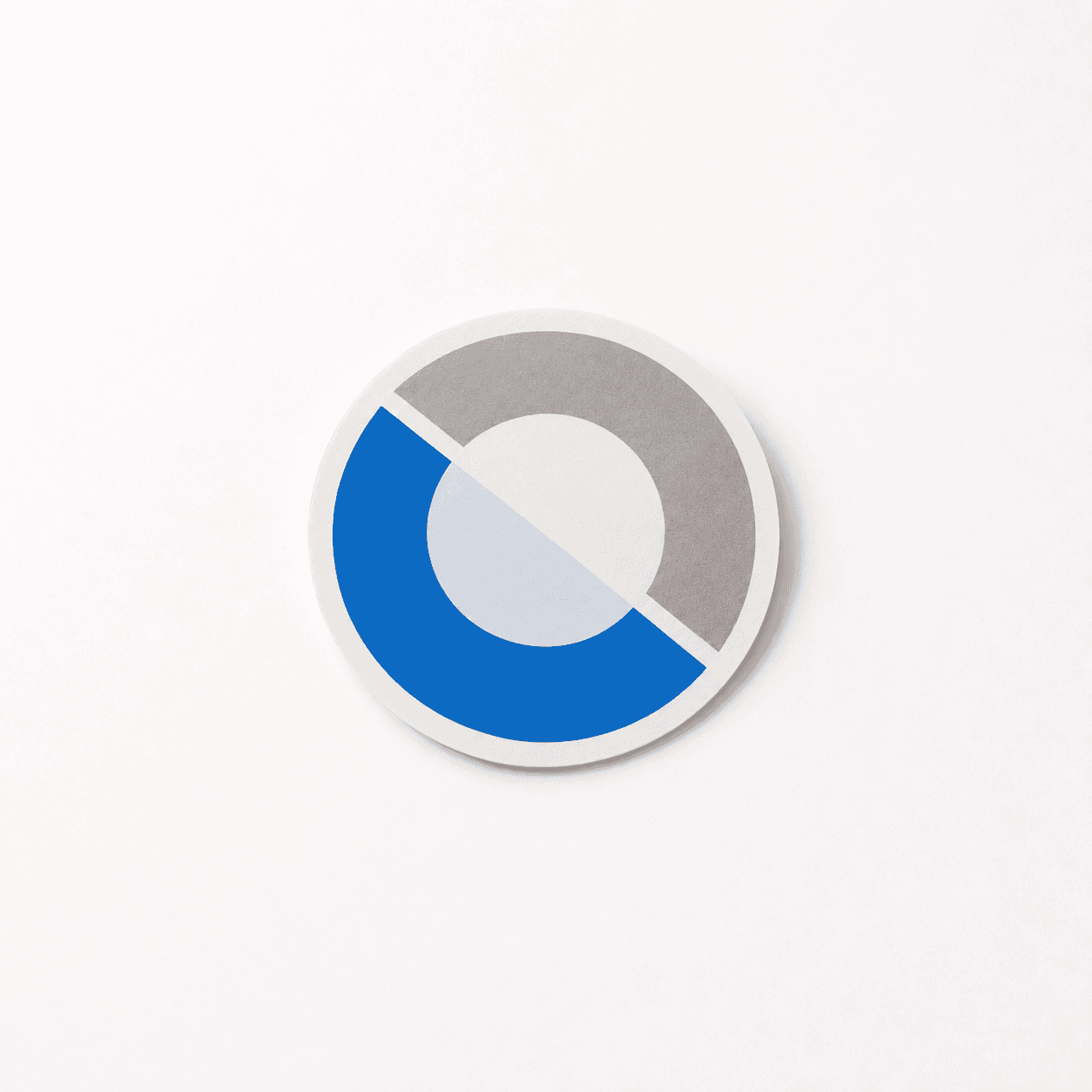 Front-facing product photo of the round Datawear sticker